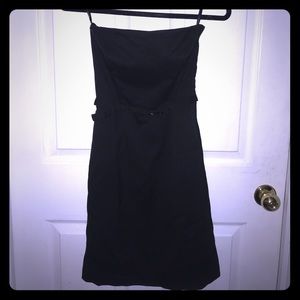 Little black dress. Strapless. Side zip kick pleat